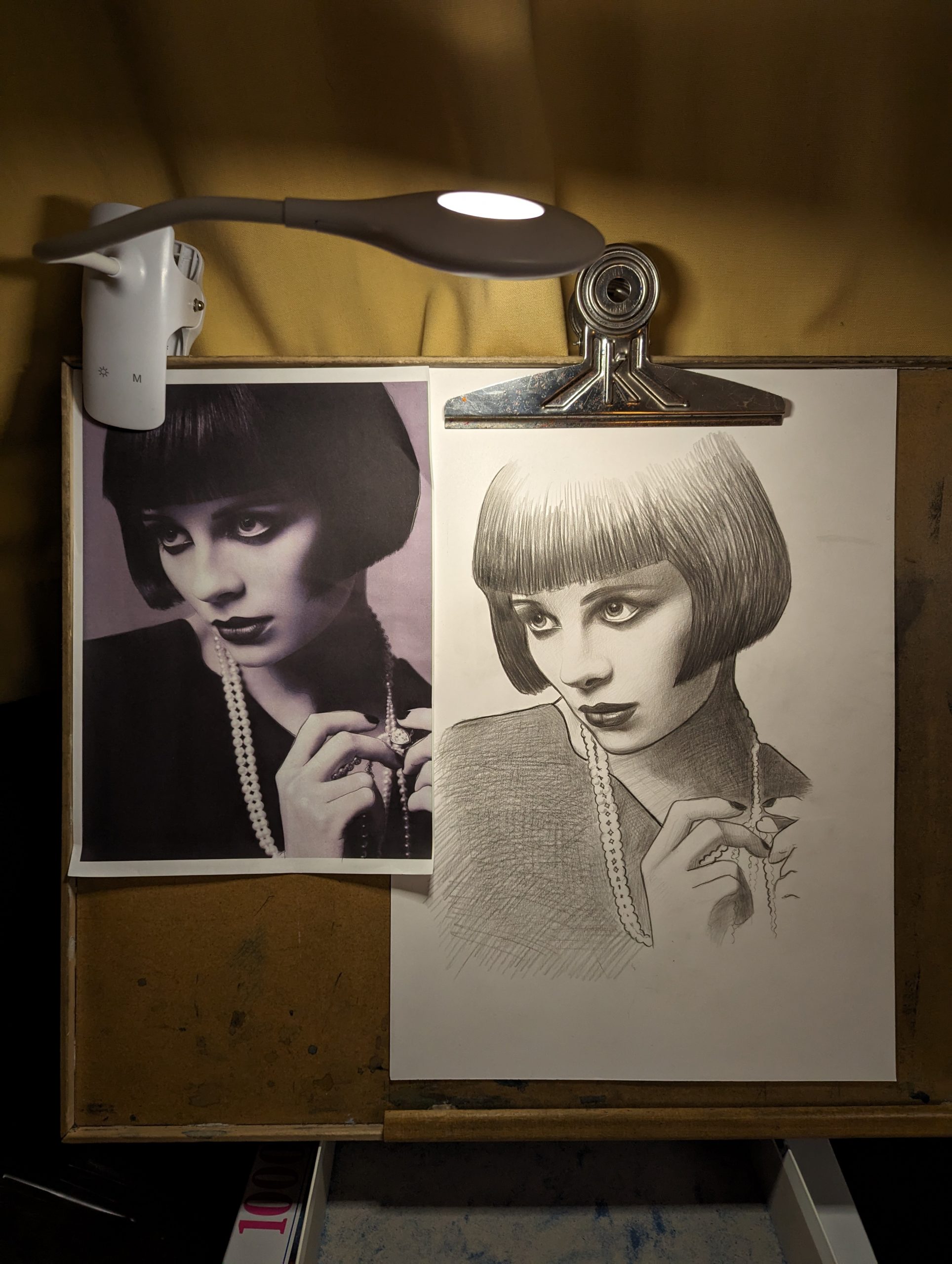 A pencil drawing of a 1920s woman with a bob haircut and dark, almost gothic make-up fiddling with some pearls around her neck.